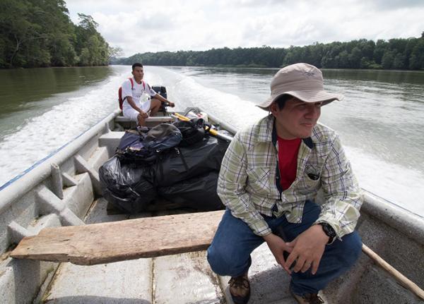 A biologist travels by boat to reach the Darien region of Panama